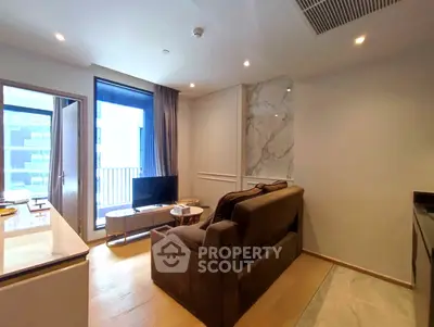 Modern living room with cozy sofa and balcony view in stylish apartment.