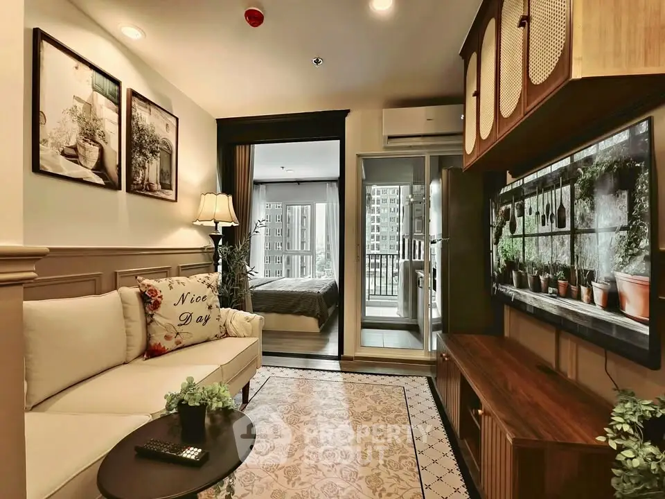 Chic living room with cozy decor and balcony view in modern apartment