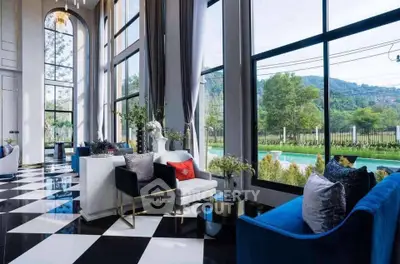Luxurious living room with floor-to-ceiling windows and stunning garden view