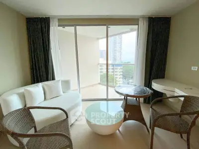 Modern living room with balcony view in high-rise apartment