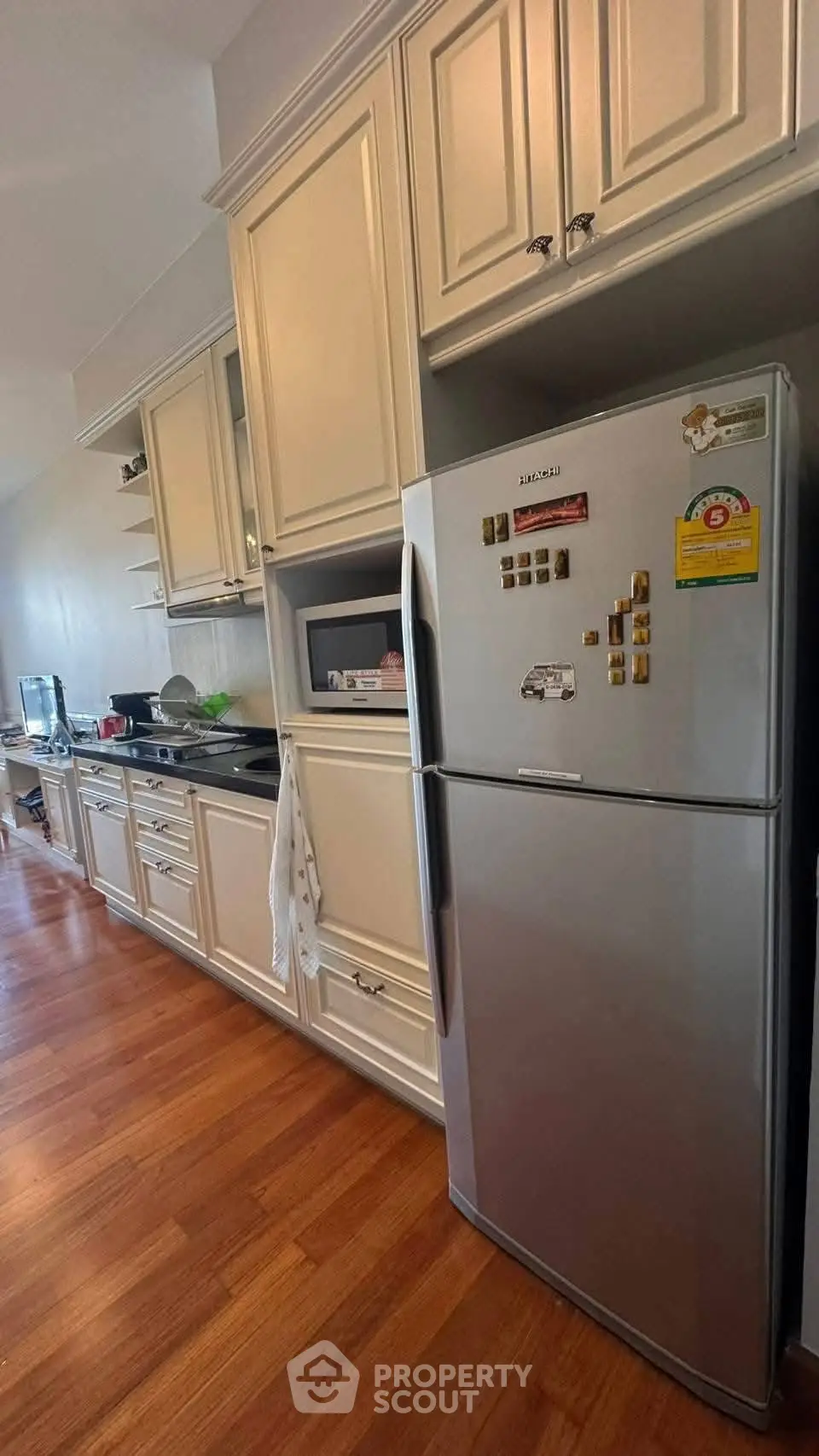 Spacious kitchen with modern appliances and elegant cabinetry, perfect for culinary enthusiasts.