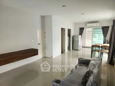 Spacious modern living room with sleek furniture and natural light