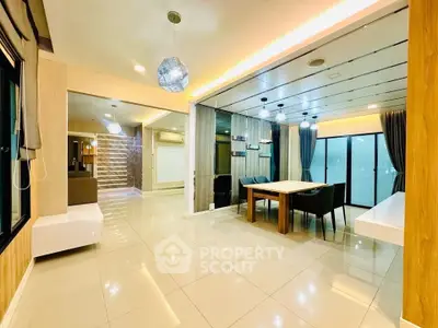 Spacious modern living room with elegant dining area and stylish lighting