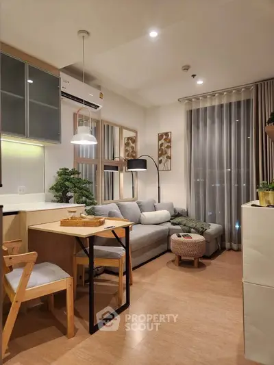Modern living room with cozy seating and stylish decor in a contemporary apartment.