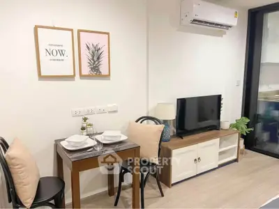 Cozy dining and living area with modern decor and air conditioning