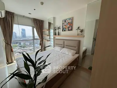 Modern bedroom with city view, featuring stylish decor and large windows for natural light.