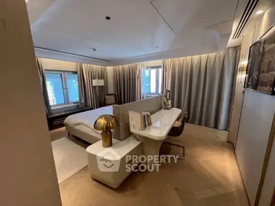 Luxurious bedroom with modern decor and city view, featuring elegant lighting and stylish furnishings.