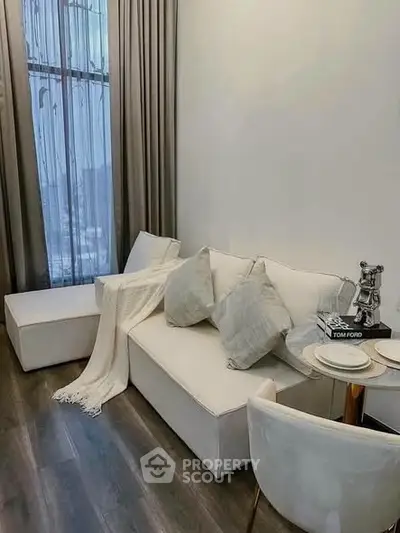 Modern living room with elegant white sofa and chic decor