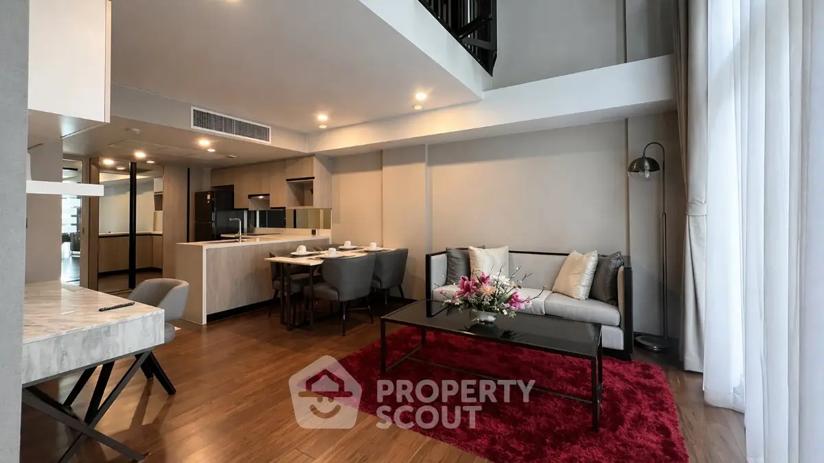 Spacious modern living room with open kitchen and elegant decor