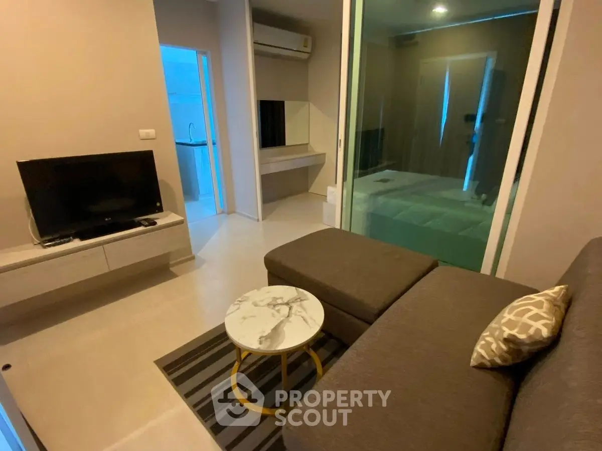 Modern living room with sleek furniture and stylish decor in a cozy apartment.