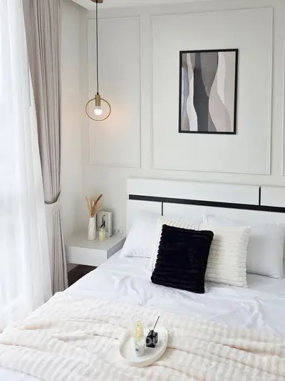 Elegant bedroom with modern decor and natural light