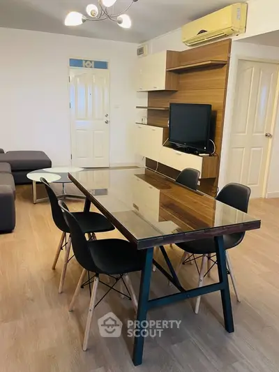 Spacious living room with modern dining area and stylish furniture