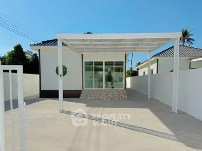 Modern single-story house with carport and minimalist design