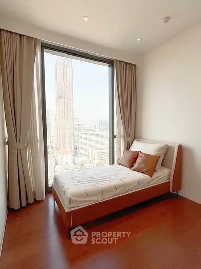 Modern bedroom with stunning city view and elegant decor