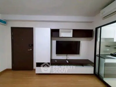 Modern living room with sleek TV unit and air conditioning