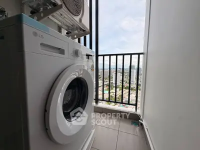 Modern apartment balcony with washing machine and city view, perfect for urban living.