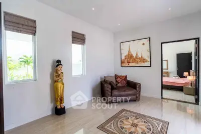 Elegant living room with cultural decor and cozy seating in a modern home