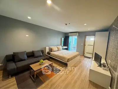 Modern studio apartment with cozy living area and stylish decor
