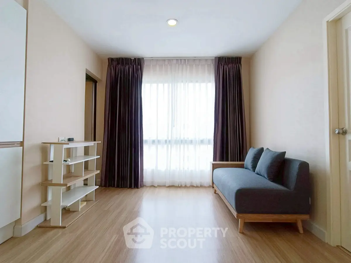 Spacious living room with modern sofa and natural light