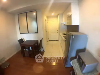 Cozy apartment kitchen with dining area and modern appliances