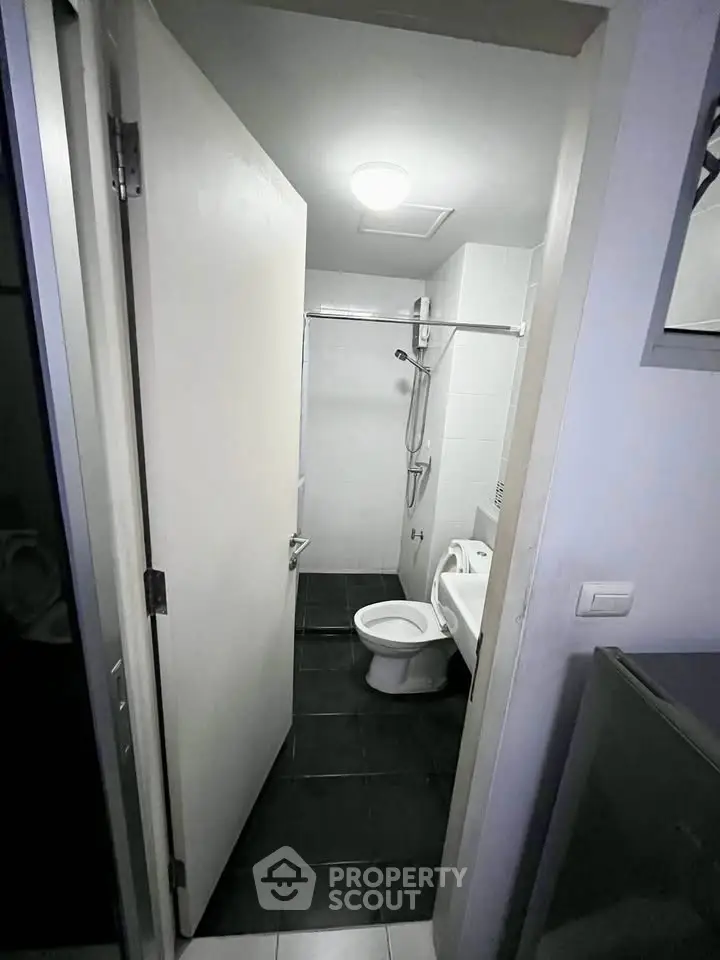 Compact modern bathroom with sleek fixtures and minimalist design