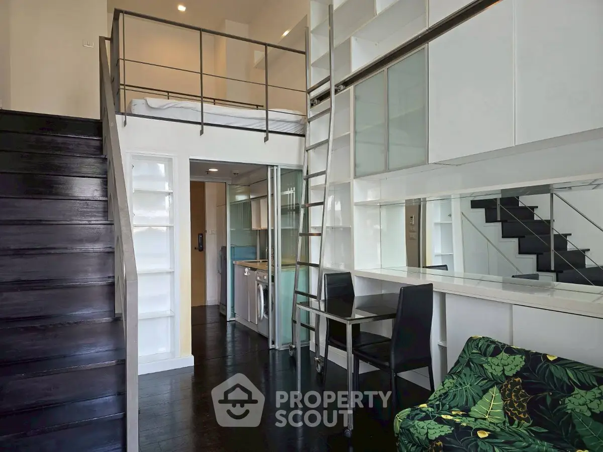 Chic loft apartment with modern interior and mezzanine bed, perfect for urban living.