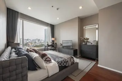 Luxurious bedroom with city view, modern decor, and elegant furnishings.