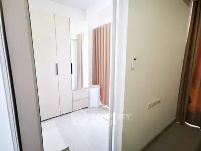 Modern bedroom with sleek wardrobe and natural light