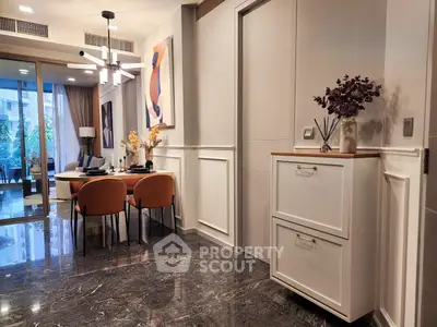 Modern dining area with elegant decor and marble flooring in a stylish apartment