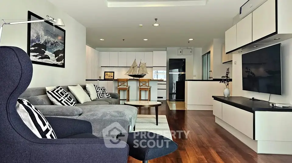 Modern living room with stylish decor and open kitchen layout