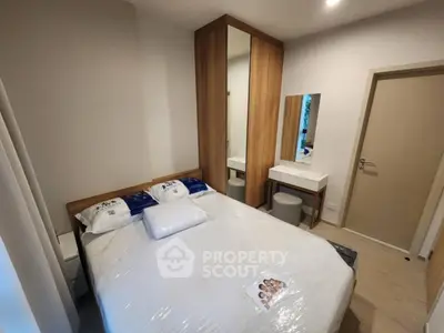 Cozy bedroom with modern furniture and ample storage space