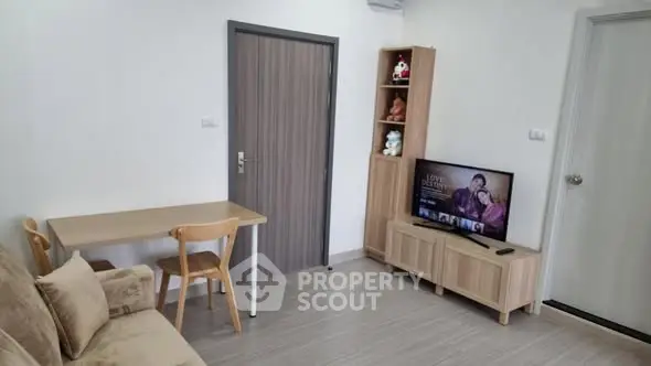 Cozy living room with modern furniture and TV setup