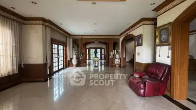 Spacious living room with elegant decor and large windows for natural light.