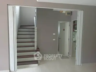 Modern interior with staircase and sliding doors in a contemporary home