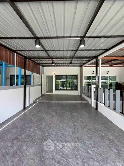 Spacious covered patio with modern design and ample natural light
