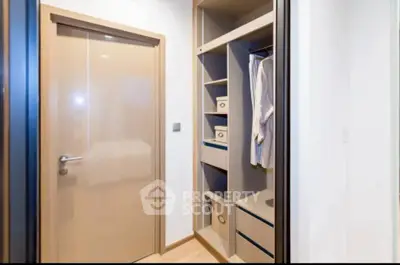 Modern walk-in closet with ample storage space and sleek design