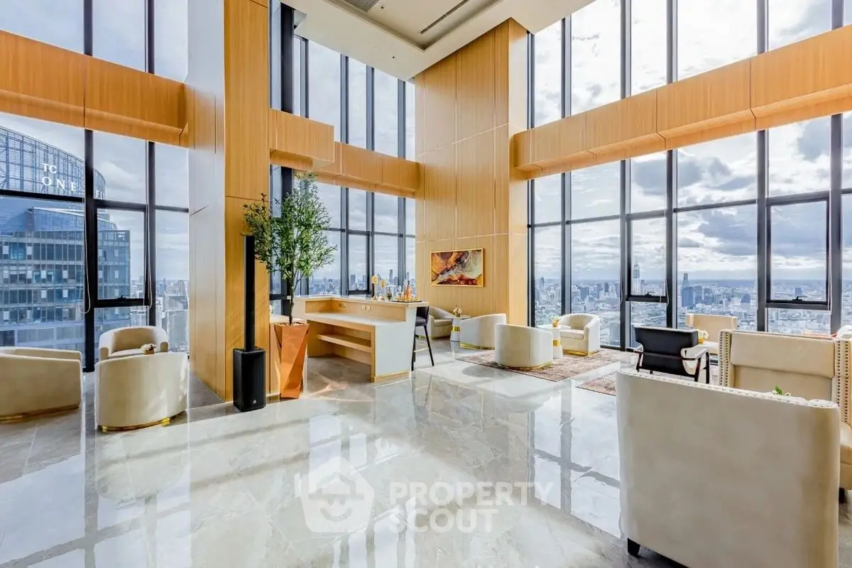 Luxurious high-rise living room with panoramic city views and elegant furnishings.