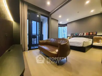 Luxurious modern bedroom with balcony and city view, featuring elegant leather sofa and stylish decor.
