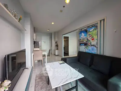Modern living room with sleek furniture and artistic wall decor in a stylish apartment.