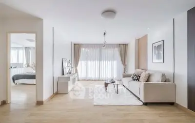 Spacious modern living room with natural light and elegant decor