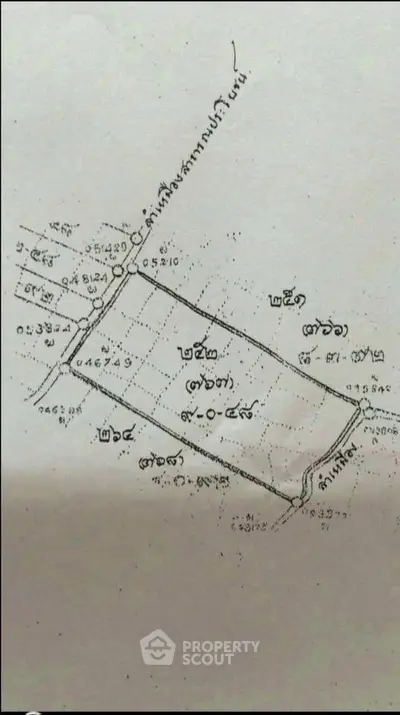 Detailed schematic plan of a real estate plot with measurements and boundaries.