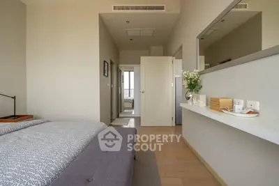 Spacious modern bedroom with elegant decor and natural light