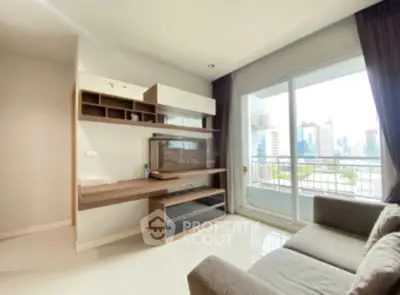 Modern living room with city view and balcony access in urban apartment