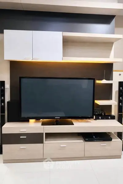 Modern living room with sleek TV unit and ambient lighting