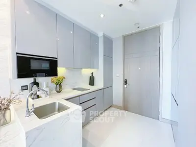 Modern kitchen with sleek cabinets and marble countertops