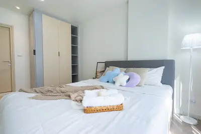 Cozy bedroom with modern decor and ample storage space