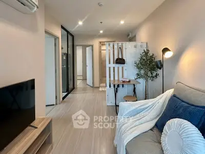 Modern living room with cozy decor and stylish furniture in a contemporary apartment.