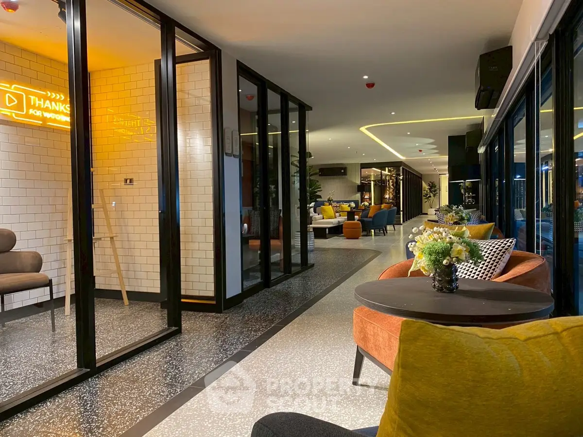 Modern co-working space with stylish seating and ambient lighting
