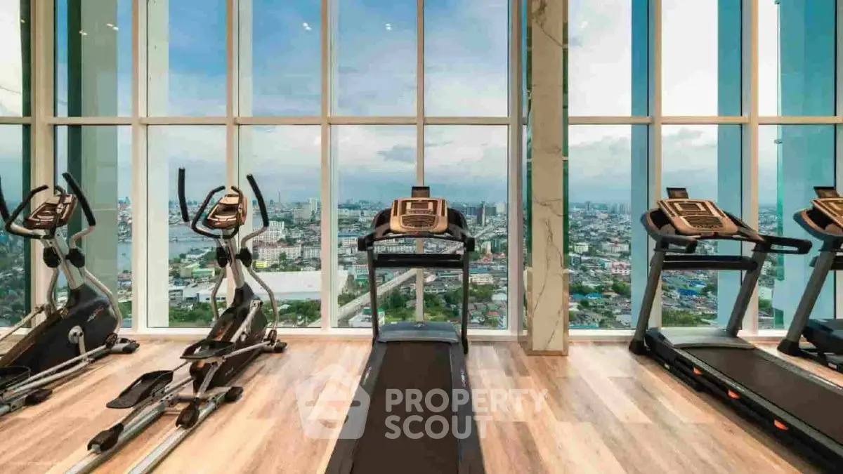 Luxury gym with panoramic city view and modern fitness equipment