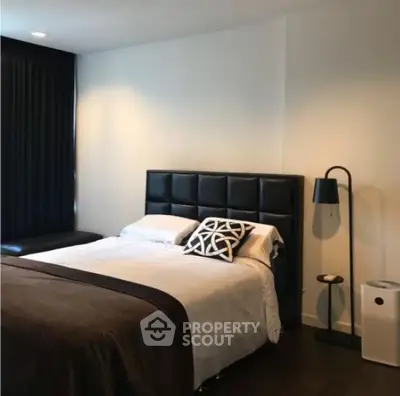 Modern bedroom with stylish decor and elegant lighting